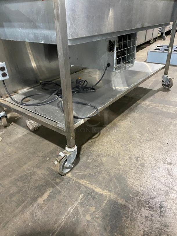 Delfield refrigerated cold food bar, model N8156B, stainless steel, with sneeze guard, undershelf, folding tray slide, on casters.