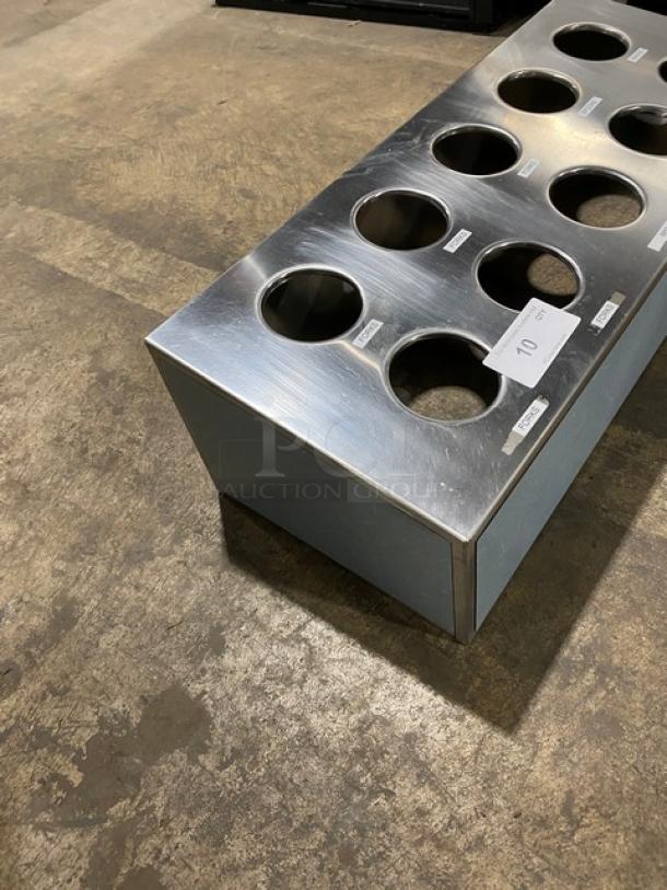 Commercial stainless steel countertop utensil organizer with 10 compartments. Durable, sleek design. Auction tag visible.