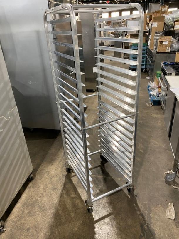 Commercial stainless steel pan rack on casters, excellent condition, multiple shelves for holding or transporting pans.