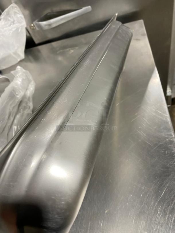 NEW Choice stainless steel 1/2-size, 2.5" deep anti-jam steamtable pan, model 4070522, shown in pristine condition.