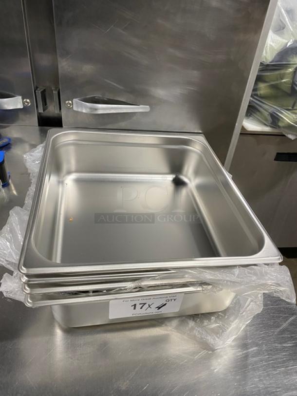 Stack of new Choice Commercial stainless steel 2/3-size 4" deep hotel pans, Model 4070142, with plastic wrap, pristine condition.