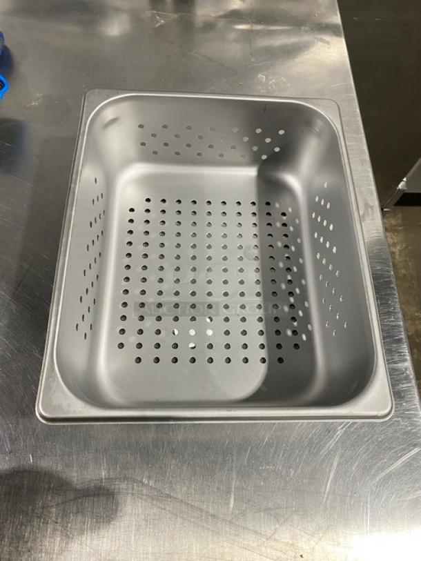 New commercial stainless steel half-size 4" deep perforated hotel pan, Model 2220243, shown on metal surface.