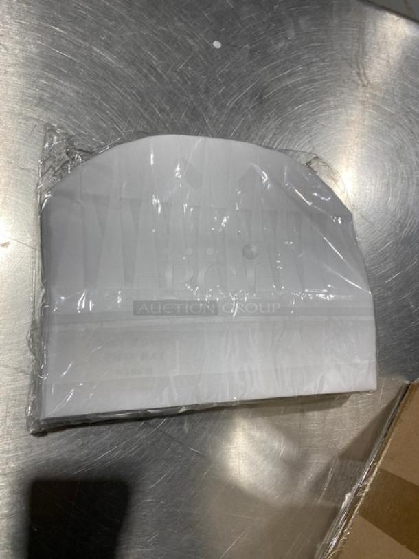 New Landau Uniforms white non-woven 9" round chef hat in packaging, pristine condition.