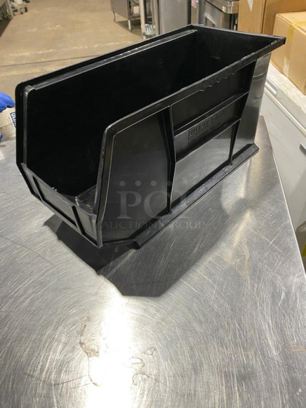 Uline black stackable utility bin, Model S-14454, in good condition, ideal for countertop organization.