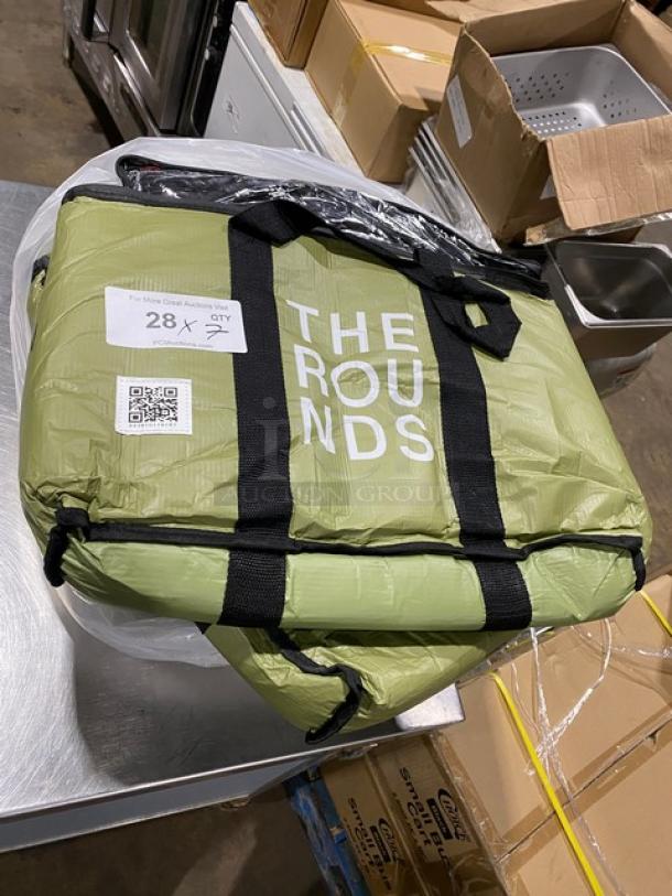 Green insulated delivery bag, brand "The Rounds," new condition. Features black straps, durable material, and commercial use.