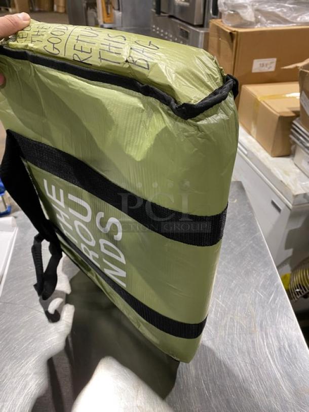 Green insulated fast food delivery carrier bag, new condition, branded "The Rounds." Durable with reinforced straps.