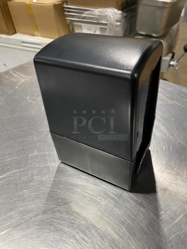 Jofel commercial black tabletop napkin dispenser, new condition, tall-fold design, durable construction.