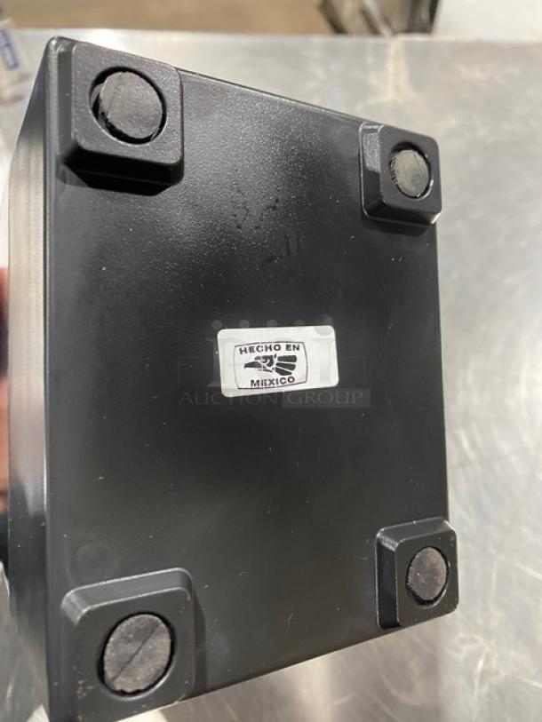 Jofel black tabletop napkin dispenser, new condition, with "Hecho en México" label on the base.