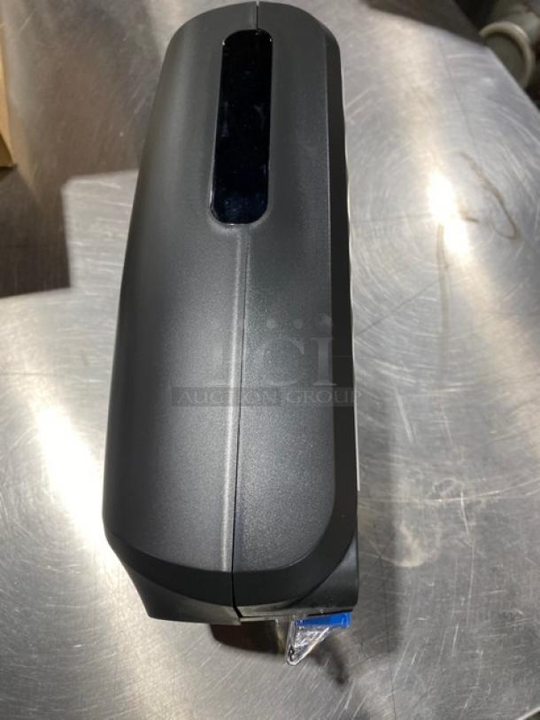 Ecolab Nexa Series black touch-free hand hygiene dispenser in new condition. Sleek design, ideal for commercial settings.