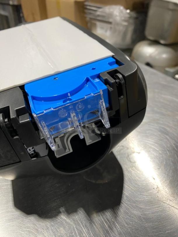 Ecolab Nexa Series black touch-free hand hygiene dispenser, new condition, commercial use.