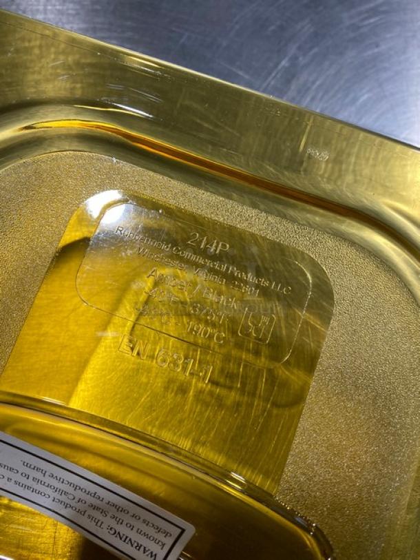 Rubbermaid Commercial Yellow Polycarbonate 1/4 Size Food Pan Cover, Model G214P86AMBR, embossed branding visible.