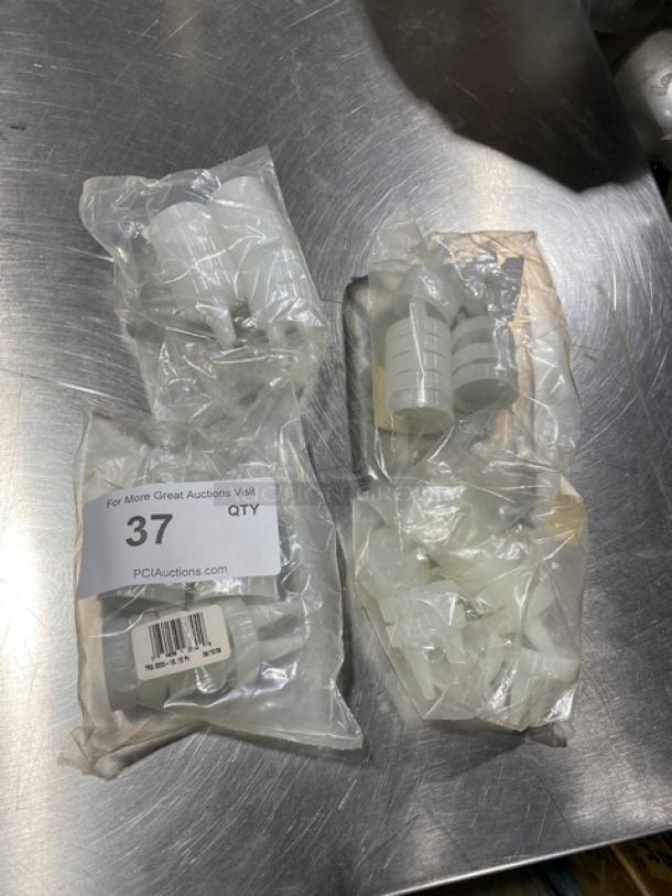 Traex TRX2200-13 condiment lids, clear, double tip, in packaging. Includes multiple units. Good condition.