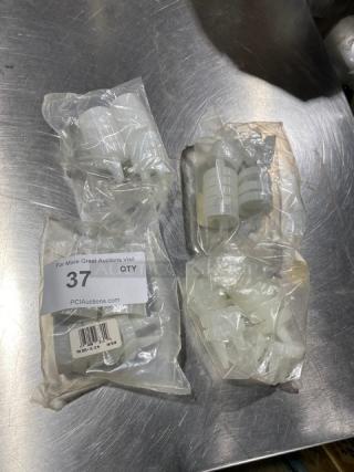 Traex TRX2200-13 condiment lids, clear, double tip, in packaging. Includes multiple units. Good condition.