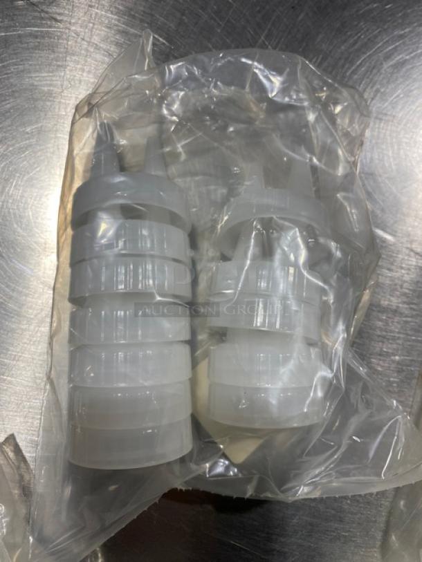 Traex Commercial Clear Double Tip Condiment Lid, Model TRX220013, in new condition, packaged in plastic.