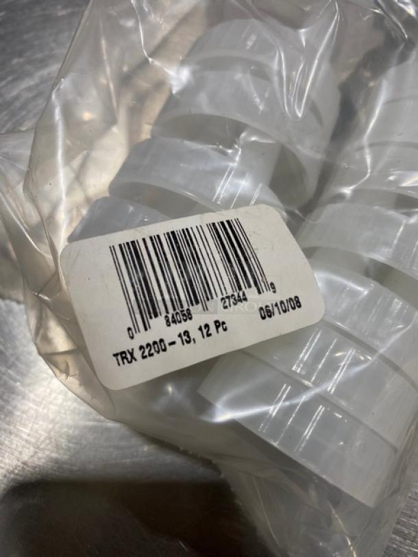 Traex Commercial Clear Double Tip Condiment Lid, Model TRX220013, in packaging. Barcode and label visible.