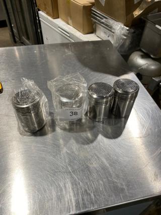 NEW ABC SSD-12 stainless steel 10 oz dredge/shaker, set of four. Features perforated lids, pristine condition, ideal for commercial use.