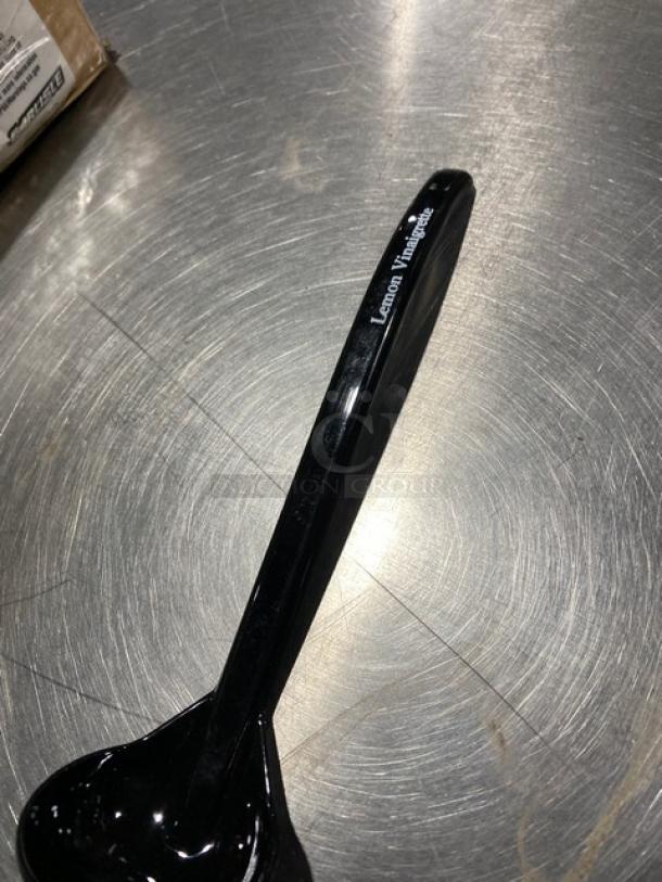 Carlisle Commercial 9.5" Black Lemon Vinaigrette Ladle, Model 02955979, new condition, text on handle visible.