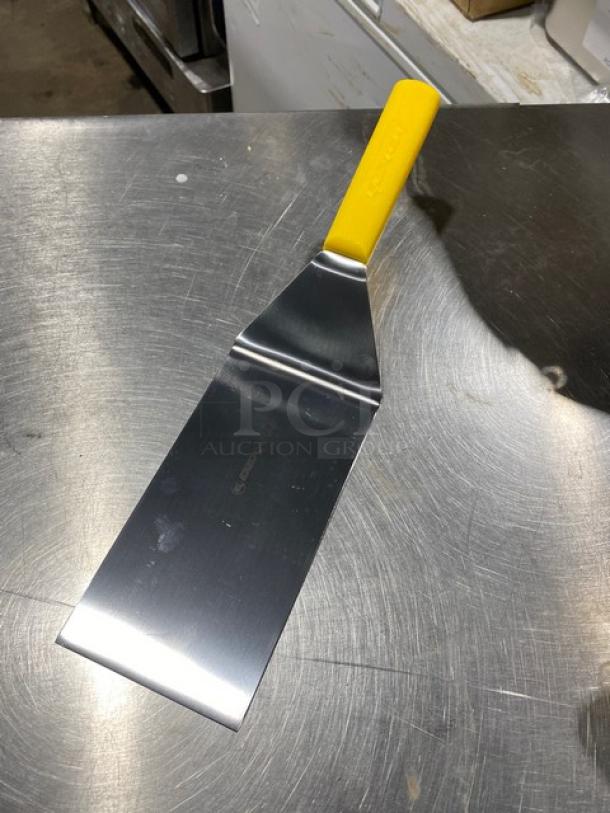 Dexter Russell Basic Series stainless steel hamburger turner, 8"x4", model P94859, new condition, yellow grip handle.