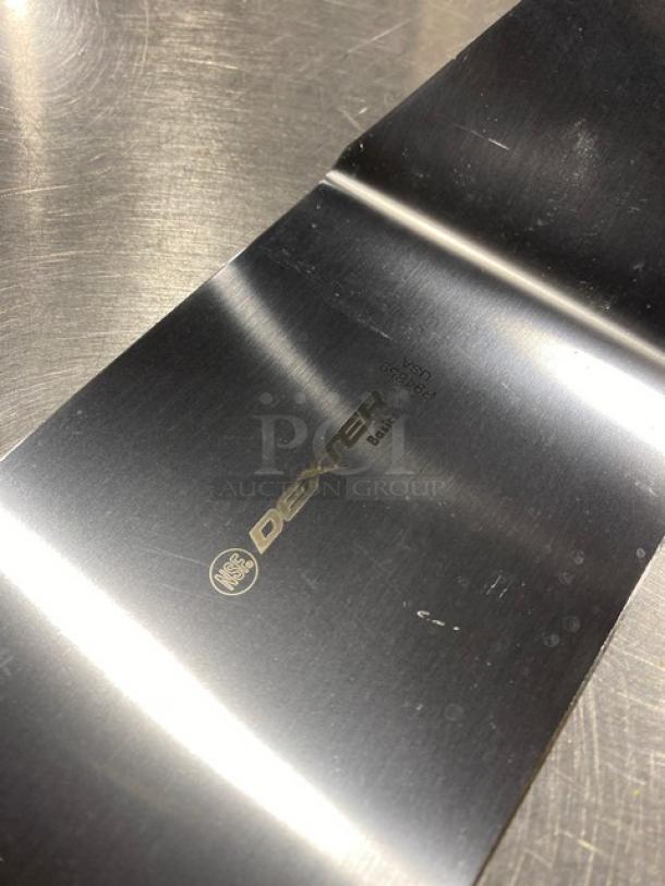 NEW Dexter Russell Basic Series 8"x4" stainless steel hamburger turner, model P94859, with a yellow grip handle.