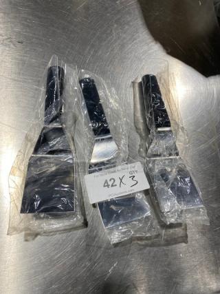 New Dexter Russell Sani-Safe Stainless Steel Hamburger Turners, Model S286-4, with black grip handles, in packaging.