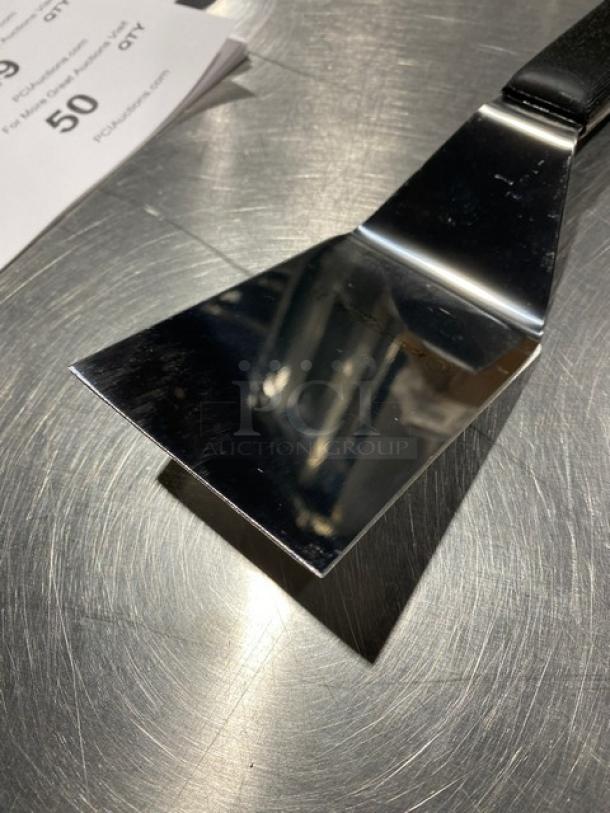 Dexter Russell Sani-Safe 4"x3" hamburger turner, stainless steel, black grip handle, model S2864, new condition.