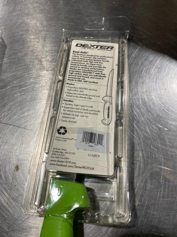 Dexter Russell Sani-Safe 6" boning knife, model S136, with stainless steel blade and green grip handle, in original packaging.