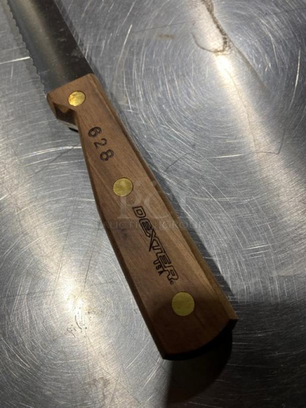 Dexter Russell 8" bread knife, model 628, with serrated stainless steel blade and wooden grip handle. New condition.