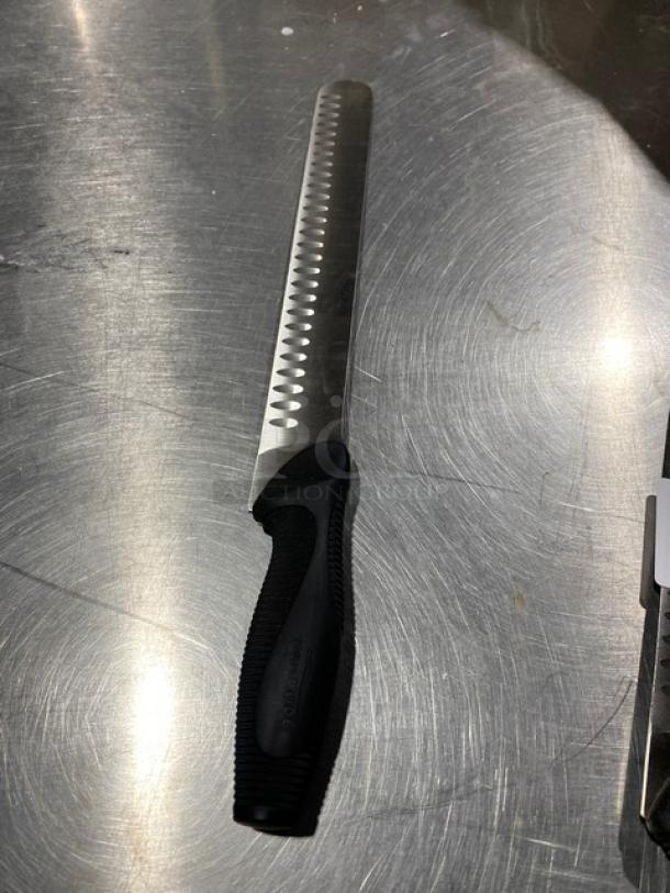 Dexter Russell DuoGlide slicing/carving knife, stainless steel blade, black grip handle, new condition.