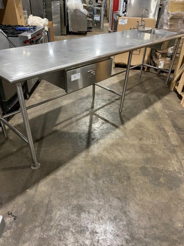 Commercial stainless steel worktop prep table with single compartment sink, faucet, pull-out drawer, and sturdy legs.