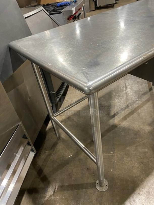 Commercial stainless steel worktop prep table with open base, right-side sink, faucet, pull-out drawer, and legs.
