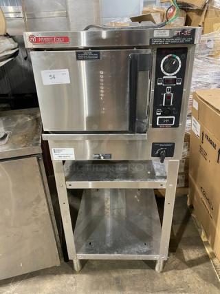 Market Forge ET-3E stainless steel pressure steamer, 208V 3-phase, with double undershelf stand, in good condition.