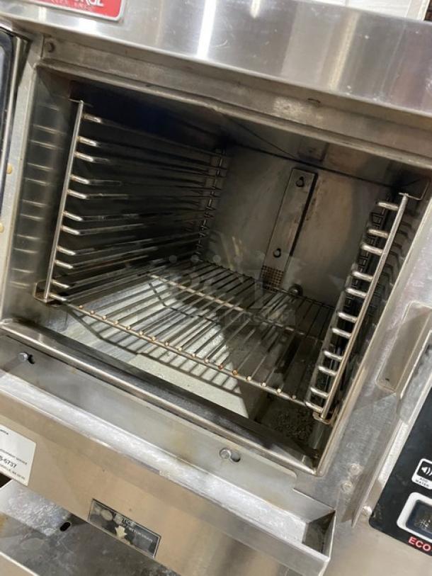 Market Forge ET3E commercial stainless steel single compartment pressure steamer with double undershelf stand, 208V 3-phase.