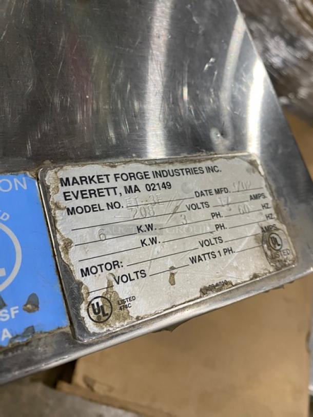 Market Forge ET-3E pressure steamer, stainless steel, single compartment, 208V 3-phase, with labels showing specifications.