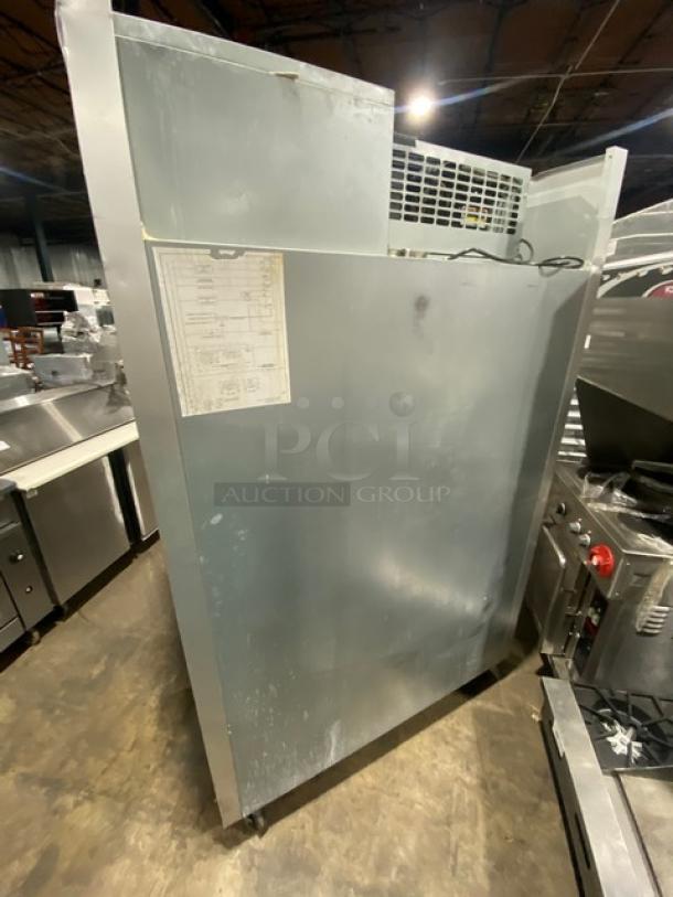 Traulsen G22010 commercial stainless steel 2-door reach-in refrigerator, electric powered, poly coated racks, on casters.