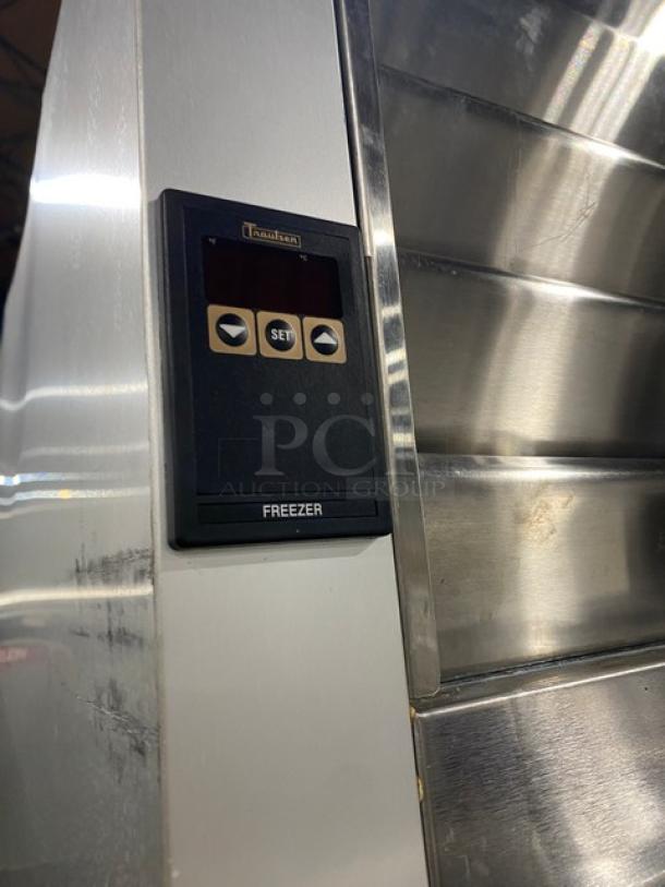 Traulsen stainless steel 2-door refrigerator, model G22010. Features digital controls, polished finish, on casters.