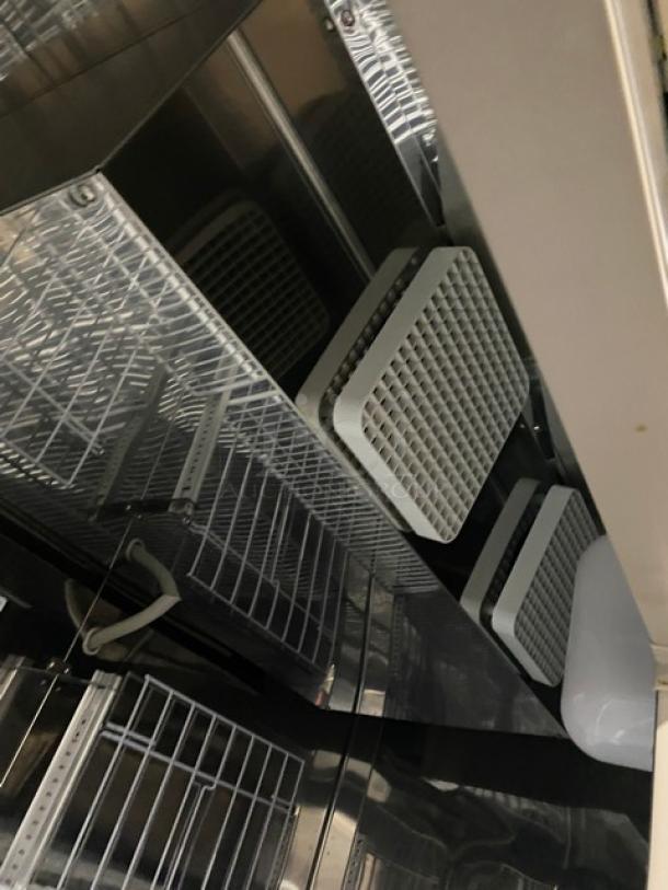 Norlake Advantedge R49-S commercial refrigerator interior with poly-coated wired racks. Stainless steel, dual doors, digital display.