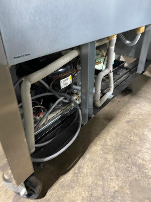 Norlake Advantedge Series commercial stainless steel 2-door refrigerator in used condition, with exposed internal components. Model: R49S.