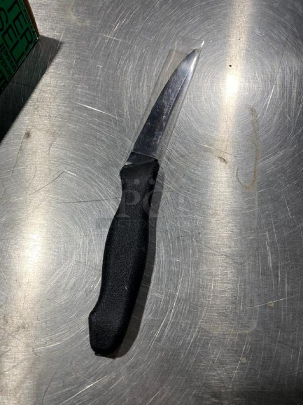 Dexter Russell Prodex boning knife, model PDSH1316ST, with stainless steel blade and black grip handle, new condition.