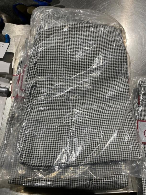 Chefwear CW11 black and white chef pants in sealed packaging, new condition, houndstooth pattern.