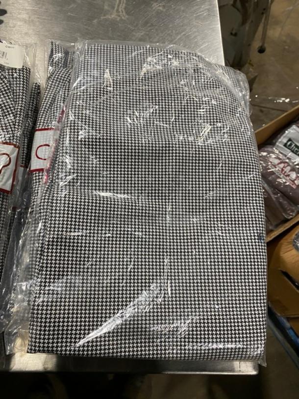 New Chefwear black & white CW3950 medium chef pants in packaging. Houndstooth pattern with tag. Ideal condition.