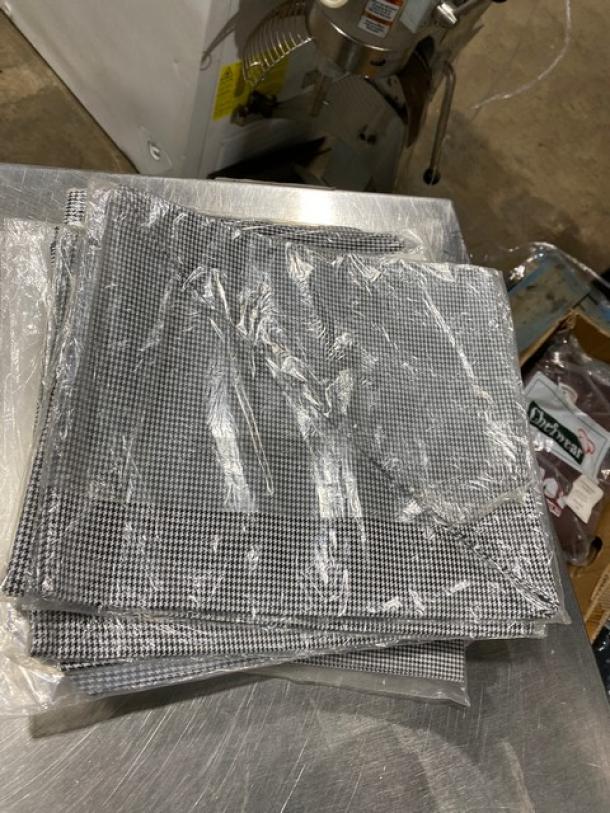 San Jamar H500HT black & white poly/cotton neckerchiefs in original packaging, new condition. Model H500HT.