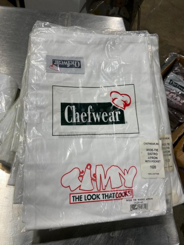 New Chefwear white cotton bistro apron, model 162040, with wide-tie and pocket. Brand logo on packaging.