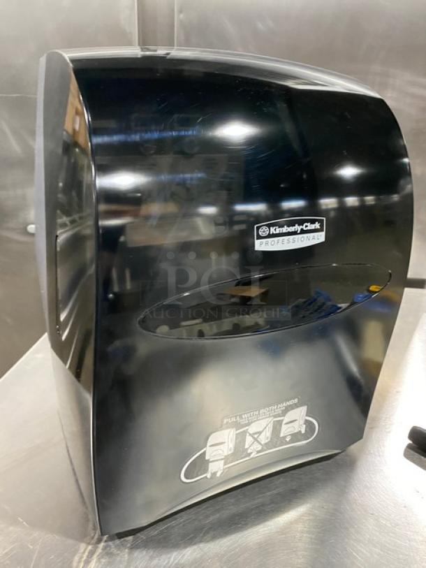 NEW Kimberly Clark Smoke Black Sanitouch Hard-Roll Paper Towel Dispenser, Model 09996, in excellent condition.