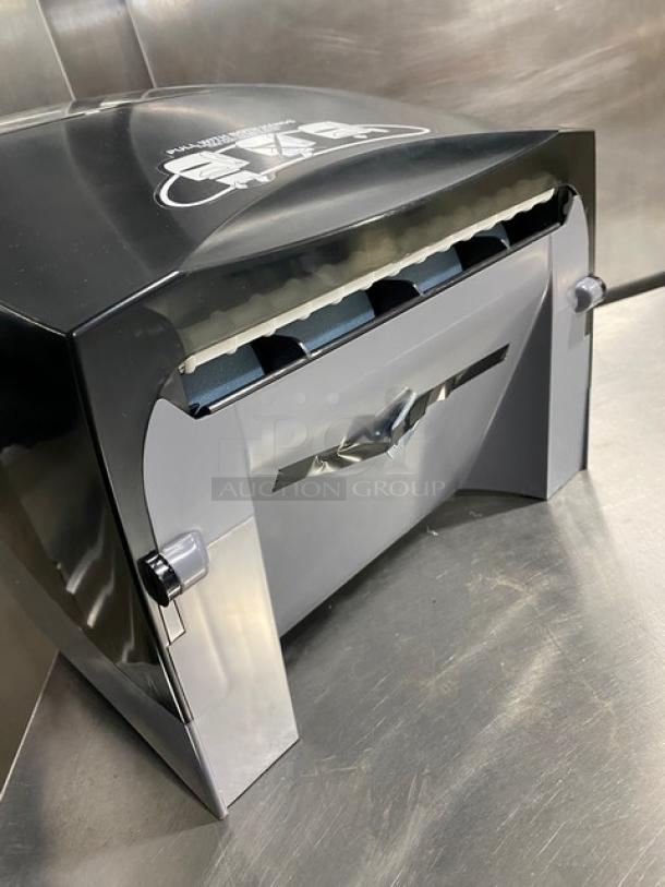 Kimberly Clark Sanitouch Hard-Roll Paper Towel Dispenser, Model 09996, smoke black, new condition.