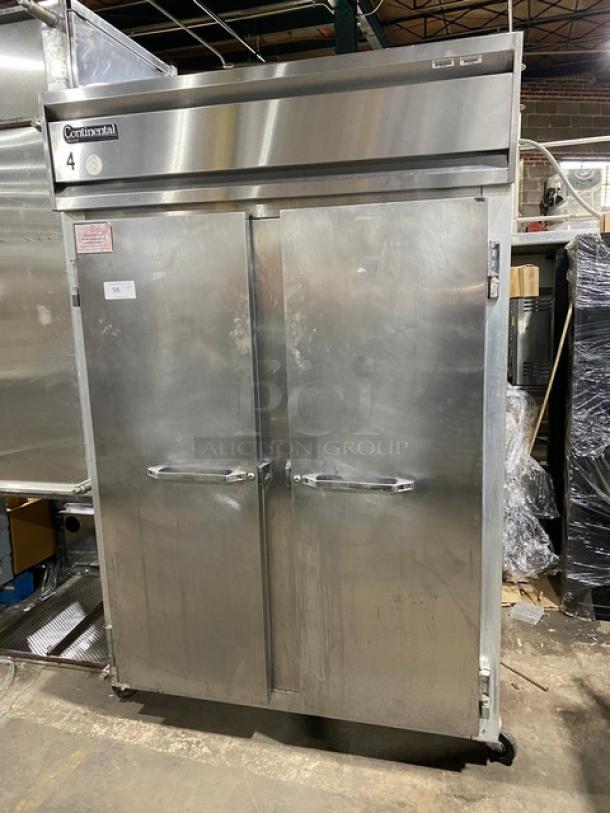 Continental 2F stainless steel 2-door reach-in freezer with pan slides, poly coated wire racks, on casters, Model: 2F SN: A98H4020.