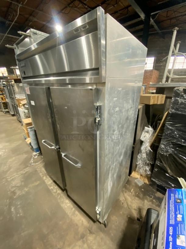 Continental 2F stainless steel 2-door reach-in freezer with pan slides, poly-coated wire racks, and casters. Model: 2F SN: A98H4020. 115V, 1 phase. Good condition.