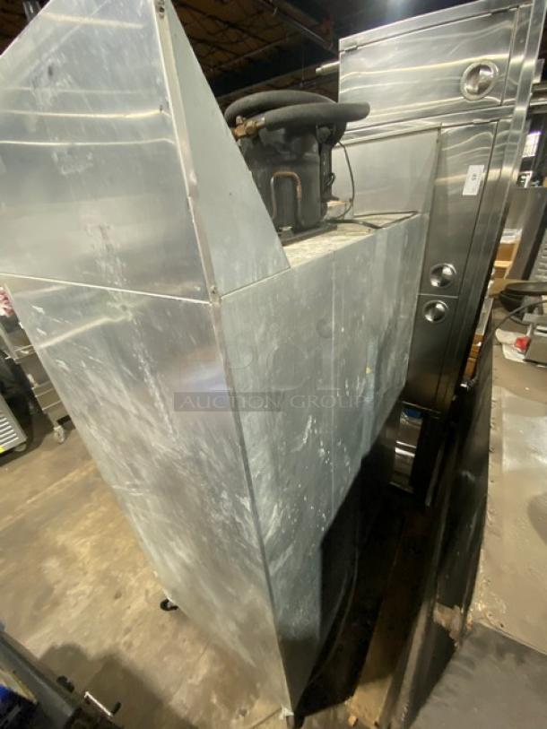 Continental commercial stainless steel 2-door reach-in freezer, model 2F, with pan slides and poly-coated wire racks, on casters.