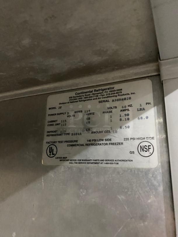 Continental 2F stainless steel 2-door reach-in freezer, 115V, poly coated wire racks, pan slides, serial A98H4020, on casters.