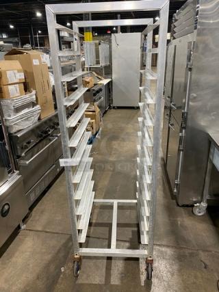 Alexander Industries commercial heavy-duty pan rack on casters, metal construction, multiple shelves, excellent condition.