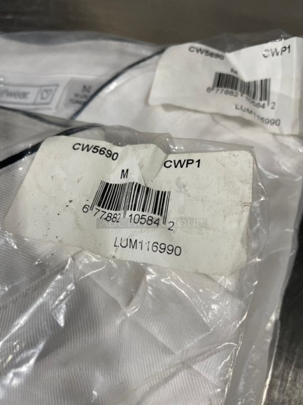 Chefwear CW5690-CWP1 white chef coat, size M, black piping, new with tags, barcode LUM116990 visible on packaging.